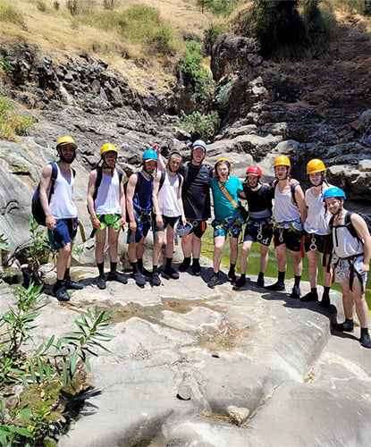Family Rappelling In The Black Canyon – Golan Heights